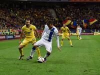 Lucian Sanmartean #17 of Romania National Team and Perparim Hetemaj #8 of Finland National Team  in action during the UEFA Euro 2016 Qualify...