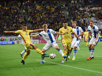 Gabriel Torje #11 of Romania National Team and Jere Uronen #18 of Finland National Team  in action during the UEFA Euro 2016 Qualifying Roun...