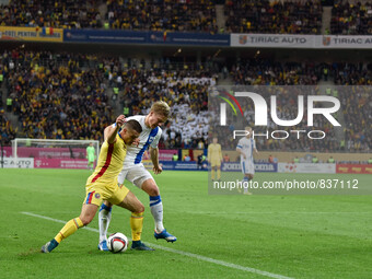 Gabriel Torje #11 of Romania National Team and Jere Uronen #18 of Finland National Team  in action during the UEFA Euro 2016 Qualifying Roun...