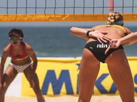 Australias’s Laird Nicole finger code (right) during the Sepanjang Beach Volley Ball Asia Pacific Tournament 2015 in Sepanjang Beach, Gunung...