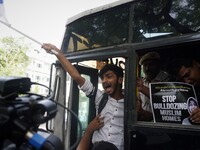 A protestor shouts slogans as he gets detained during a demonstration outside Uttar Pradesh house alleging targeted demolition drive against...
