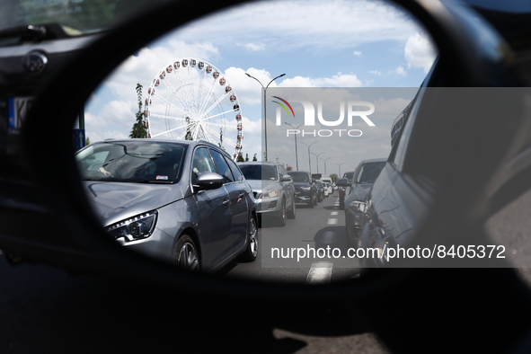 Cars standing in a traffic jam are reflected in the car's mirror in Krakow, Poland on June 15, 2022. 