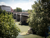 A view of the Tevere river at the Isola Tiberina at risk of dryness during the drought that hit the city of Rome in the last months,  on Jun...