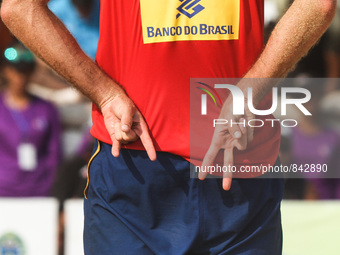 Australias’s Cole Durrant fingers code during the men's final match of Sepanjang Beach Volley Ball Asia Pacific Tournament 2015 in Sepanjang...