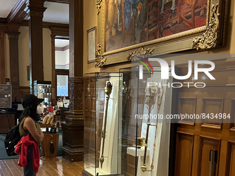 Woman looks at the Mace and the original  Mace of Upper Canada on display inside the Ontario Legislative Building in Toronto, Ontario, Canad...