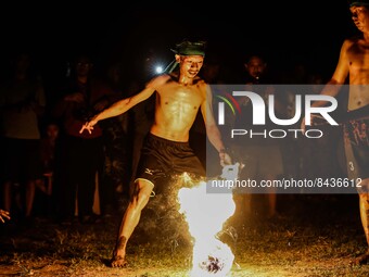 Villagers playing fire football, known locally as 