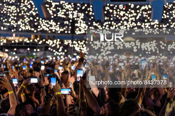 Fans create plays of light with their smartphones during the concert of the singer Vasco Rossi in Bari at the San Nicola stadium on June 22,...