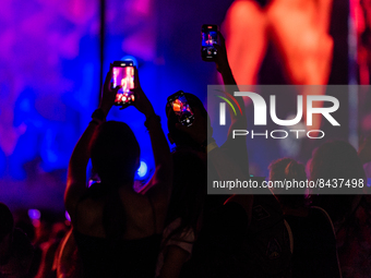 Fans create plays of light with their smartphones during the concert of the singer Vasco Rossi in Bari at the San Nicola stadium on June 22,...