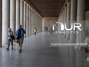 Tourists visit the Stoa of Attalus  during a heatwave in Athens, Greece, on June 23, 2022 (
