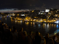People celebrate Sao Joao (Saint John) in the streets of Porto, Portugal on June 23, 2022. The celebration, which is the most importante for...