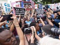 Anti-abortion rights demonstrators celebrate outside of the Supreme Court in Washington, D.C. on June 24, 2022, as it is announced that the...