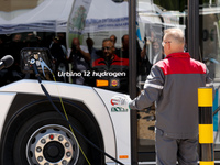 A technician tanks a bus at a mobile hydrogen power station as Poland introduces its first hydrogen bus -Urbino 12 Hydrogen into public tran...