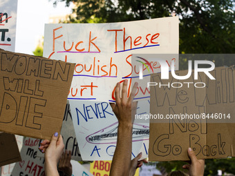 Protestors hold pro-choice signs during a protest against the Supreme Courts decision to overturn Roe V. Wade on Friday June 24, 2022 in New...