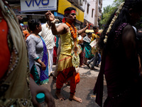 A Hindu devotee with a metal skewer pierced through his mouth takes part in a religious procession to mark the 'Muthu Mariamman' festival in...