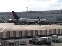 A Delta Air Lines Boeing 767 wide body jet airplane as seen in front of the airport terminal, connected to the jetbridge. US airline carrier...