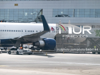 A Delta Air Lines Boeing 767 wide body jet airplane as seen in front of the airport terminal, connected to the jetbridge. US airline carrier...