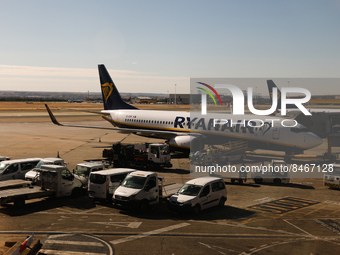 Airport vehicles and Ryanair airplanes are seen at the Barajas airport in Madrid, Spain on June 27, 2022. (