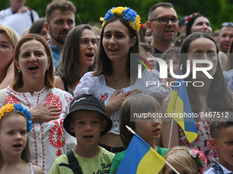 Members of the local Ukrainian diaspora repeat before an attempt to set a world record in the simultaneous performance of 'Red Kalina' in Kr...