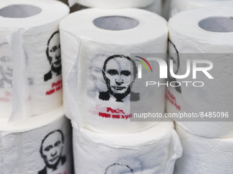 Rolls of toilet paper with a printed face of Vladimir Putin and a quote 'Putin, idi na chui' is being sold at a street stand in Warsaw, Pola...