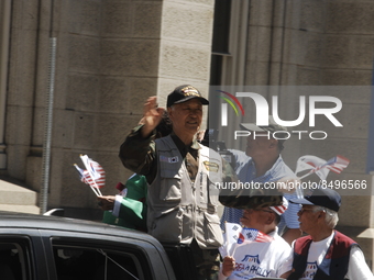 Korean War Vets wave at the crowd during the Independence Day Parade in Philadelphia, PA, on July 4, 2022. (