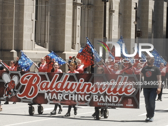 Baldwinsville Marching Band Flag team from Baldwinsville, New York takes the lead as they march in the Independence Day Parade in Philadelph...