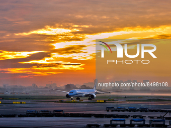 KLM Royal Dutch Airlines airplane seen during sunrise at Amsterdam Airport Schiphol in Amsterdam, Netherlands, Europe, on May 03, 2022. (