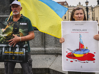 Ukrainian citizens attend a demonstration of solidarity with Ukraine at the Main Square, demanding freedom for Azovstal 4308 regiment defend...