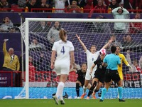 Beth Mead of England scores her team's first goal before the UEFA Women's Euro 2022 opening match in Group A between England and Austria at...