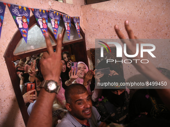 Former Palestinian prisoner Hosni Issa, celebrates with friends and family and Members of Al-Quds Brigades, the military wing of Islamic Jih...