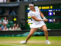 Ons Jabeur of Tunisia in action against Marie Bouzkova of the Czech Republic during the quarter-final of the 2022 Wimbledon Championships, G...