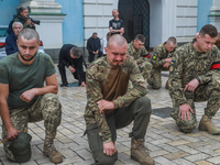 Ukrainian military cries during farewell ceremony for the officer of the 2nd separate mechanized brigade Andriy Verkhoglyad, Kyiv, St. Micha...