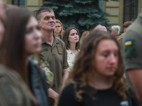 Woman cries during farewell ceremony for the officer of the 2nd separate mechanized brigade Andriy Verkhoglyad, Kyiv, St. Michael's Cathedra...