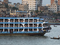People board crowded ferries as they travel back home ahead of Eid al-Adha, the feast of the sacrifice in Dhaka, Bangladesh on July 8, 2022....