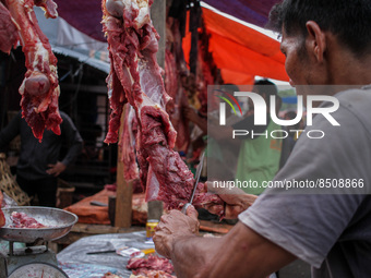 People are seen gathering at a traditional market to buy meat, as a tradition before celebrating Eid al-Adha called 'Meugang' in Lhokseumawe...