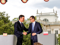 The Prime Minister of Poland, Mateusz Morawiecki and Spanish PM, Pedro Sánchez shake hands at a press conference at Royal Baths Park, Palace...