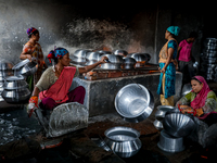 Women work inside a kitchen utensils factory at Shyampur in Dhaka, Bangladesh on July 4, 2022.  (