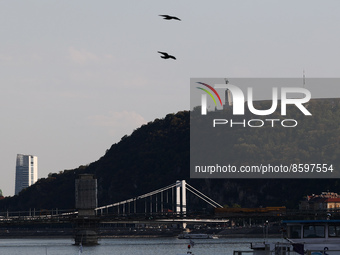 View of the Gellert Hill and bridges on the Danube River in Budapest, Hungary on July 28, 2022. (