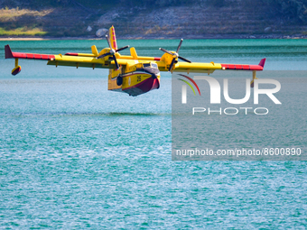 A Canadair CL-415 of the Fire Brigade, while loading water into the Salto Lake reservoir in the Province of Rieti. In Rieti, Italy, on 29 Ju...