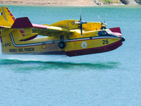 A Canadair of the Fire Brigade during water refuelling in Lago del Salto, an artificial reservoir often used by aerial vehicles for water re...