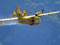 A Canadair CL-415 during take-off after refuelling in Lago del Salto, in the Province of Rieti, Italy, on 29 July 2022.  (