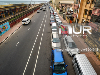 Cars line up for fuel near a fuel station. July 30, 2022 Colombo, Sri Lanka (