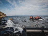 A boat full of migrants reaches on the shores of Lesbos, Greece from Turkey, on September 26, 2015.  (