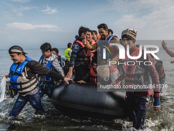 A group of migrants from Afghanistan arrive on the shore of Lesbos, Greece, on September 27, 2015.  (