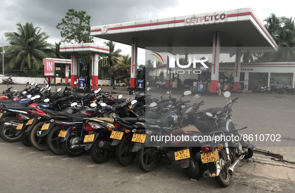 Motorbikes are parked in front of a Ceylon petroleum corporation fuel station in Colombo, Sri Lanka, hoping to buy fuel on July 31, 2022. 