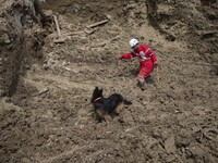 Five days after a sudden flooding in the flooded village of Mazdaran in Firoozkooh county 124 km (77 miles) northeast of Tehran, a member of...