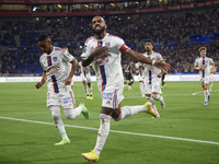 Alexandre Lacazette of Olympique Lyonnais celebrates after scoring his sides first goal during the Ligue 1 match between Olympique Lyonnais...