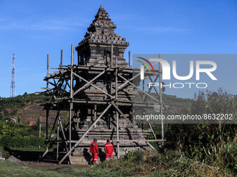 Tourists looking at the Setiaku temple of the Dieng mountain area in Banjarnegara, Central Java province, Indonesia, August 6, 2022. (