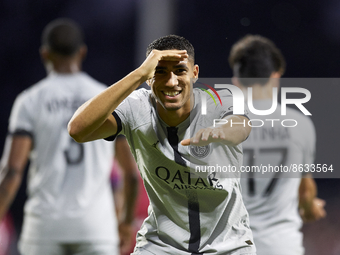 Achraf Hakimi of PSG celebrates after scoring his sides first goal during the Ligue 1 match between Clermont Foot and Paris Saint-Germain at...