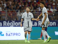 Lionel Messi of PSG and Hugo Ekitike during the Ligue 1 match between Clermont Foot and Paris Saint-Germain at Stade Gabriel Montpied on Aug...