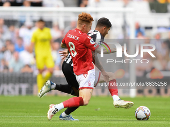 Jack Colback of Nottingham Forest battles with Bruno Guimaraes of Newcastle United during the Premier League match between Newcastle United...